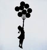 little girl holding balloons